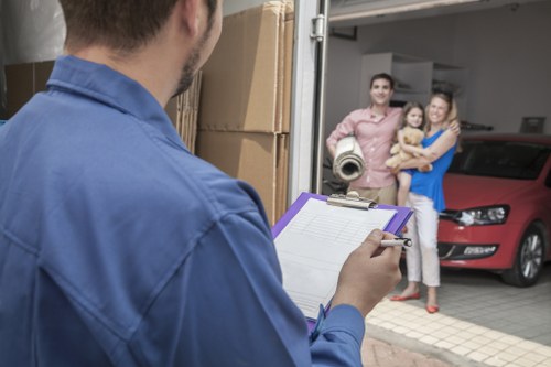 Removal team planning a local move in Colyers with boxes and furniture