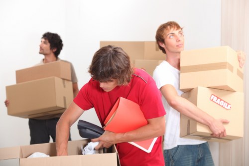 Large furniture and boxes being prepared for transport in Colyers