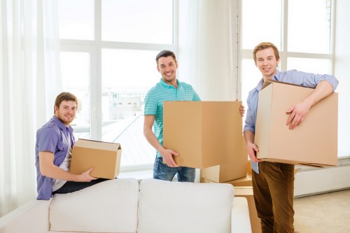 Professional movers handling office equipment in Colyers