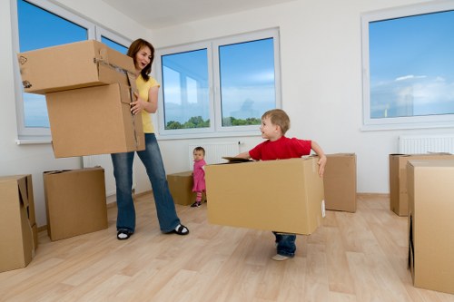 Team unloading office furniture and equipment at a new business premises
