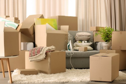 Office furniture and equipment being prepared for a commercial move in Colyers
