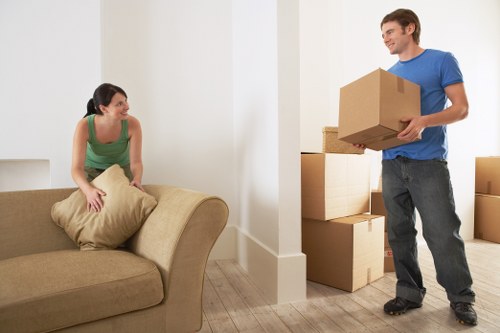 Removal team separating cardboard, wood, and metal for recycling